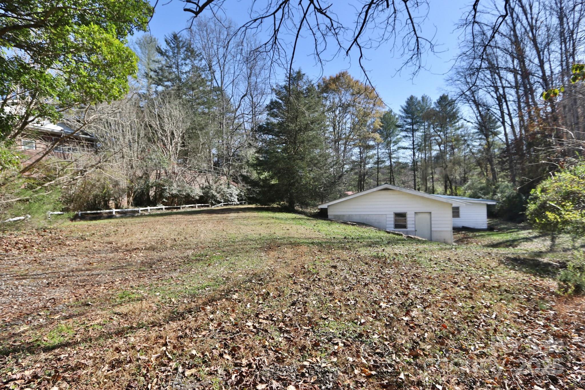 5313 Friendship Circle Road East Bend, NC 27018 - Photo 45 of 48 a backyard of a house with lots of green space