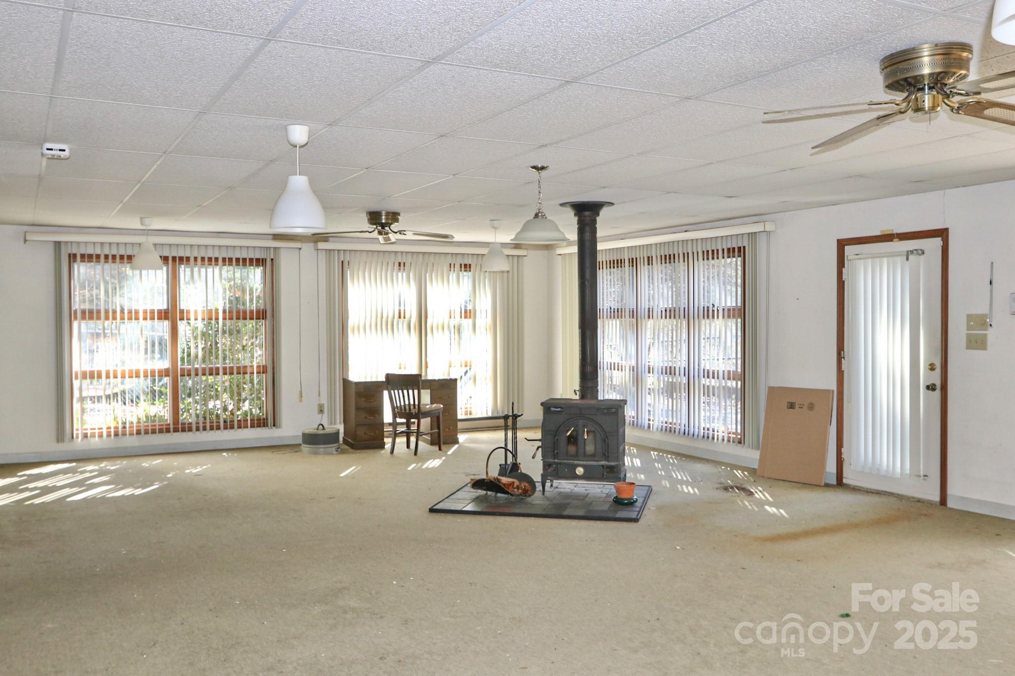 5313 Friendship Circle Road East Bend, NC 27018 - Photo 6 of 48 a living room with furniture and large windows