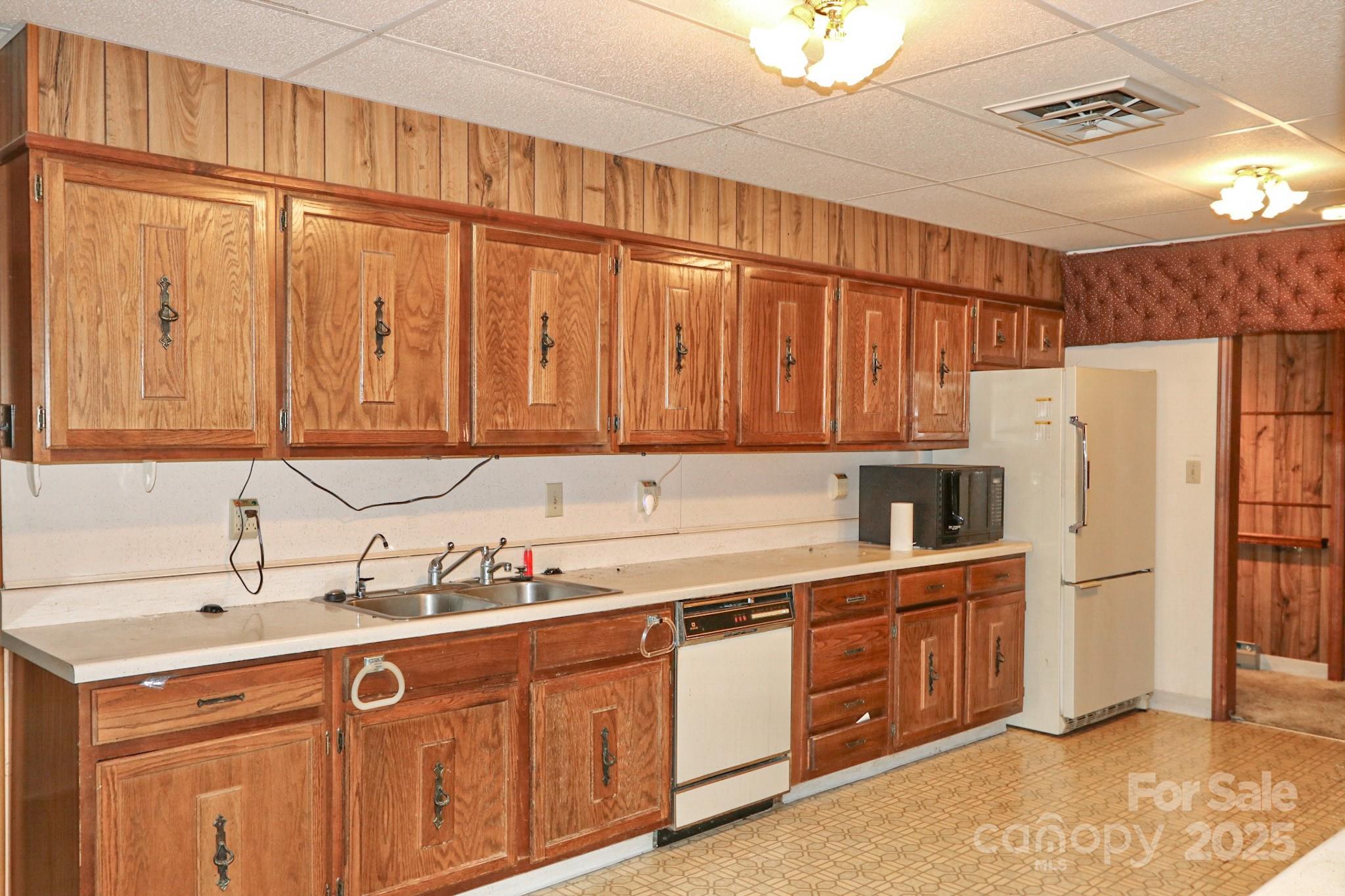 5313 Friendship Circle Road East Bend, NC 27018 - Photo 8 of 48 a kitchen with stainless steel appliances a refrigerator sink and cabinets