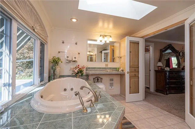 a bed room with a bed and a chair