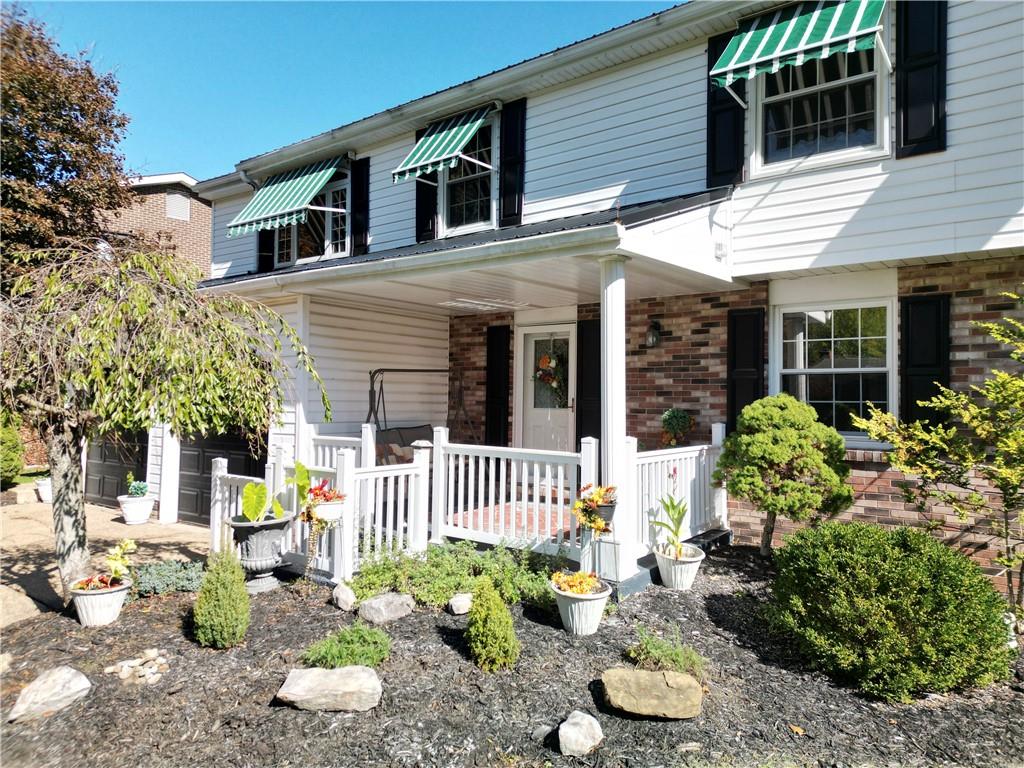 2174 Ramsey Road Monroeville, PA 15146 - Photo 3 of 44 a front view of a house with a garden