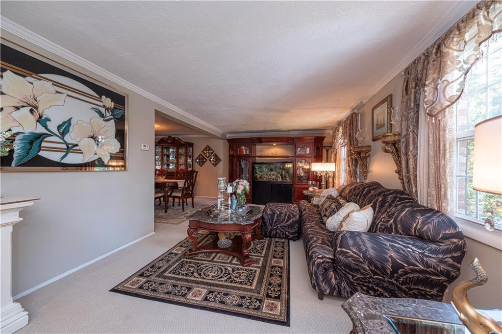 2174 Ramsey Road Monroeville, PA 15146 - Photo 8 of 44 a living room with furniture and a fireplace
