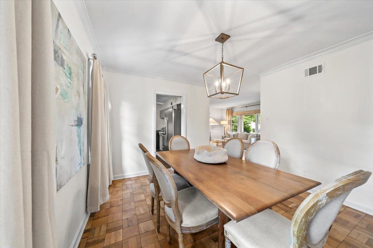 401 Avon Road Memphis, TN 38117 - Photo 13 of 27 a view of a dining room with furniture wooden floor and chandelier