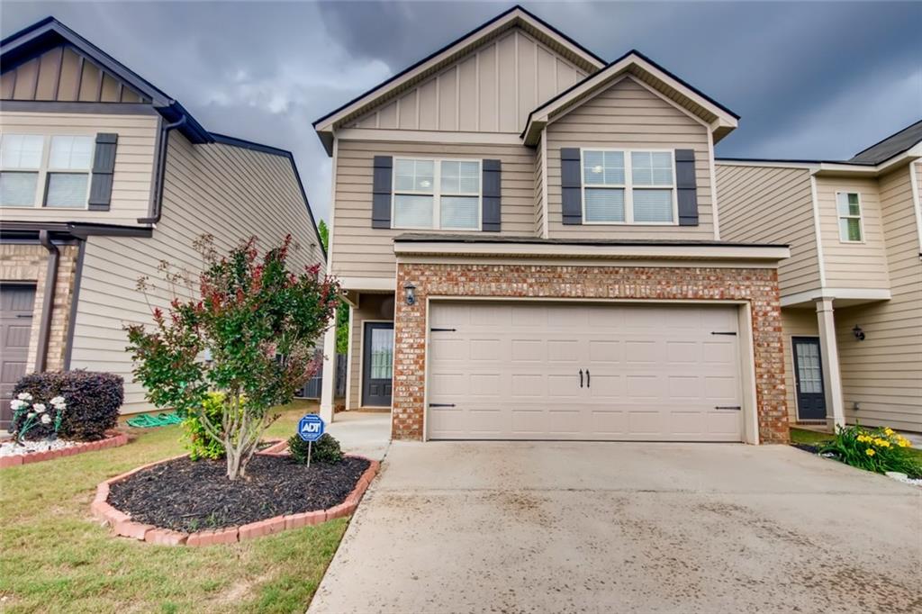 3160 Broadleaf Trail Road Fairburn, GA 30213 - Photo 1 of 1 a front view of a house with garden