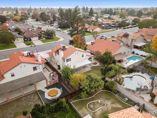 an aerial view of residential building with parking space