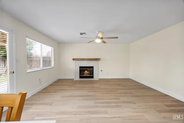 a kitchen with a sink cabinets and a window