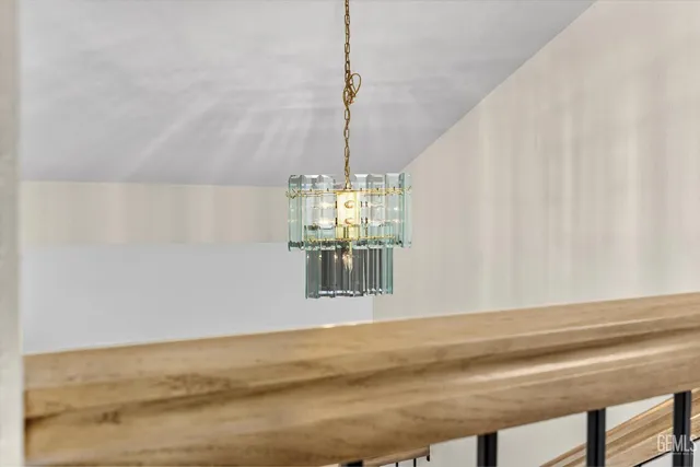 a spacious bathroom with a double vanity sink and mirror