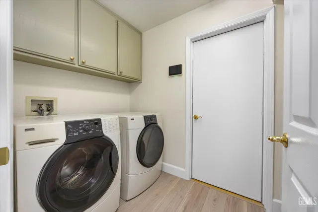 a bedroom with a bed and a potted plant