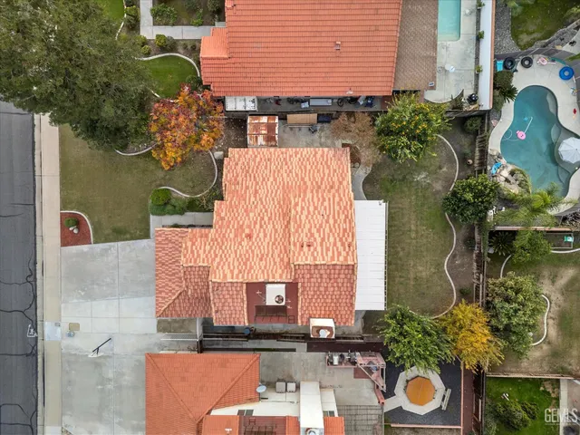 an aerial view of a house with yard
