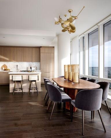a view of a dining room with furniture and window