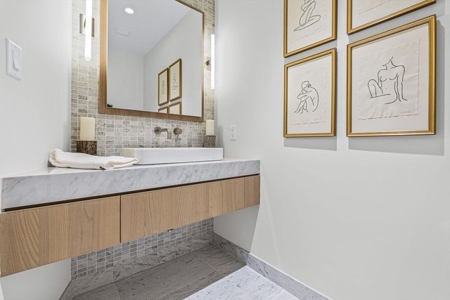 a bathroom with a sink and a mirror