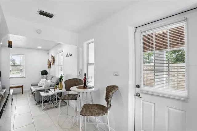 a kitchen with a refrigerator and a sink