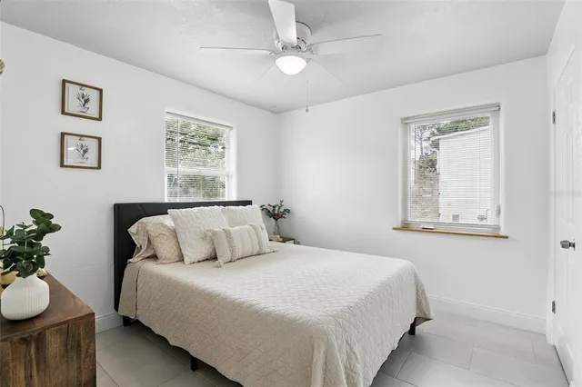 a bedroom with a bed and window