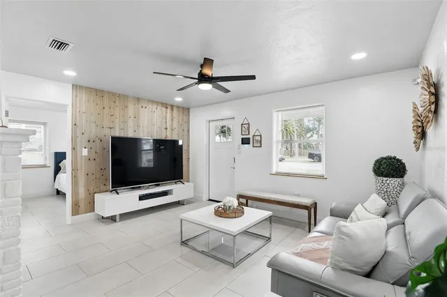 a living room with furniture and a large window
