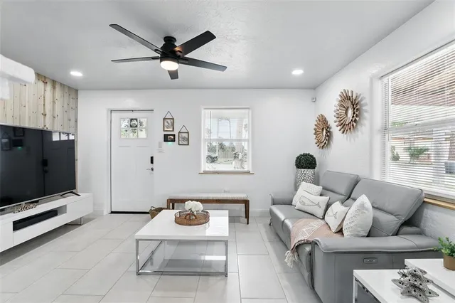 a kitchen with a refrigerator and furniture