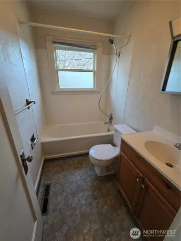a bathroom with a toilet and a sink