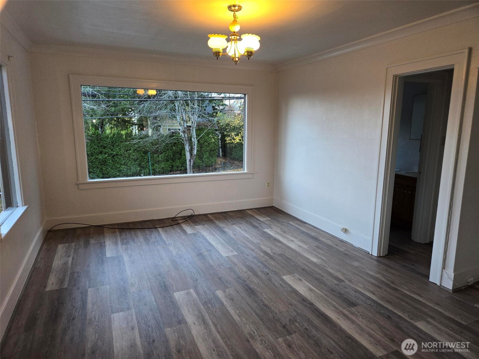 500 Gladstone Street Bellingham, WA 98225 - Photo 3 of 16 an empty room with wooden floor and windows