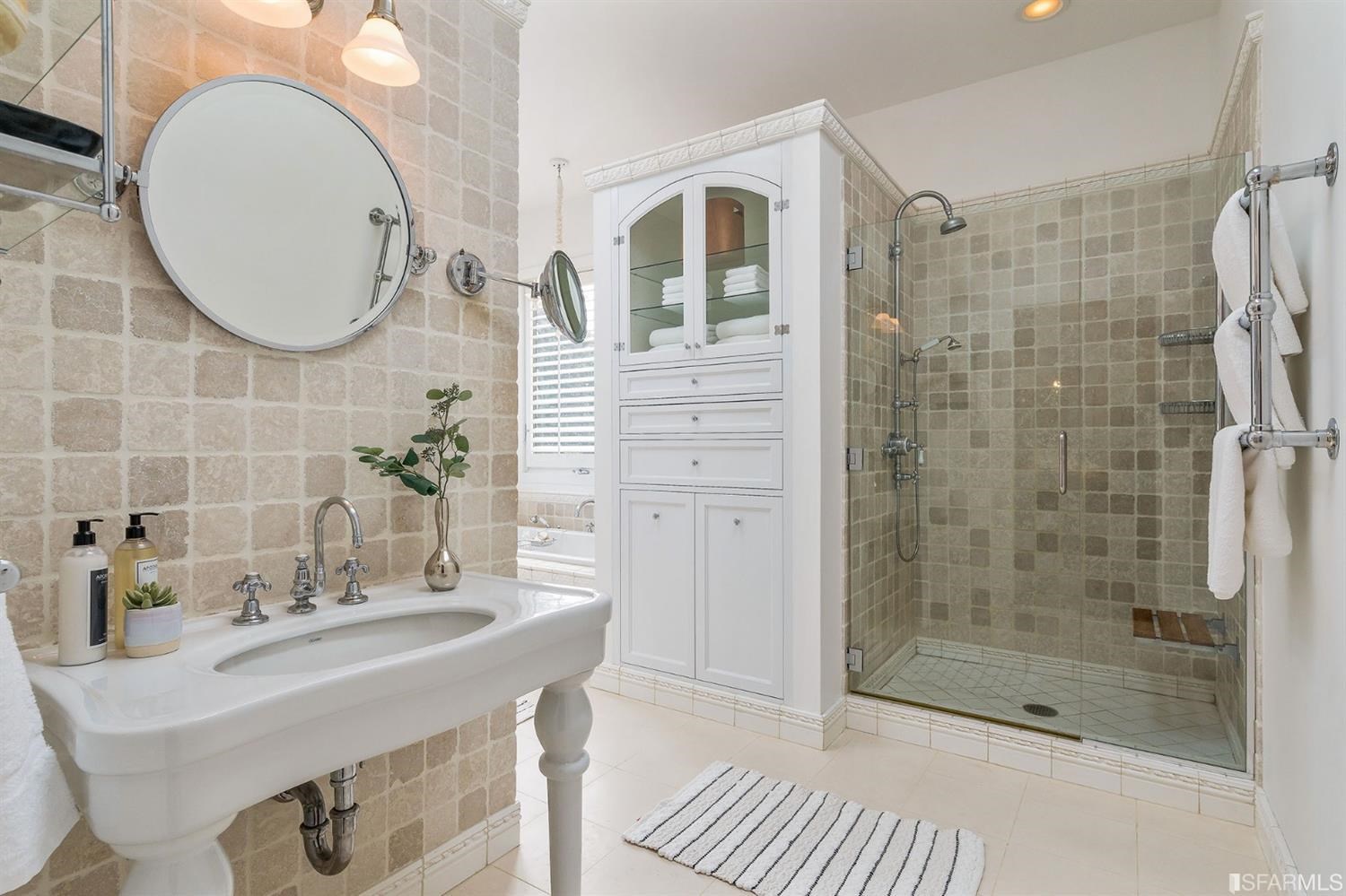 135 Sea Cliff Avenue San Francisco, CA 94121 - Photo 33 of 69 a bathroom with a sink mirror and shower