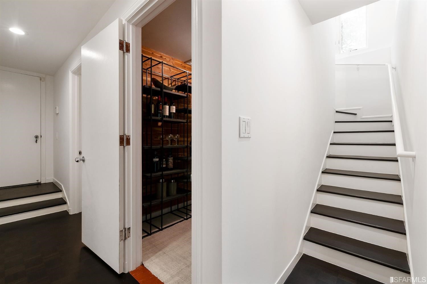 135 Sea Cliff Avenue San Francisco, CA 94121 - Photo 47 of 69 a view of a hallway with stairs and a closet