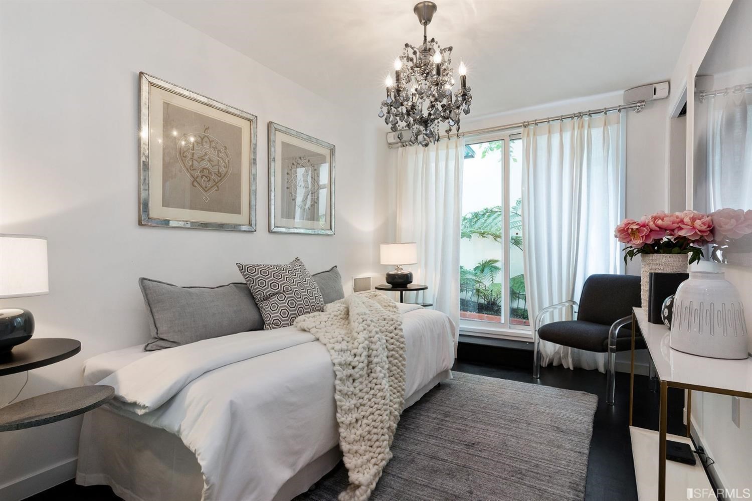 135 Sea Cliff Avenue San Francisco, CA 94121 - Photo 53 of 69 a bedroom with furniture and a chandelier