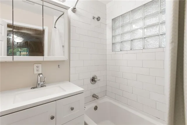 a bathroom with a sink and a bathtub
