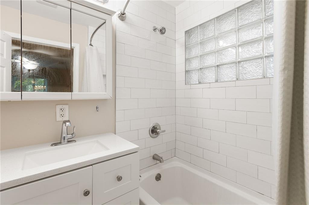 3653 North Street Northwest Duluth, GA 30096 - Photo 11 of 21 a bathroom with a sink and a bathtub