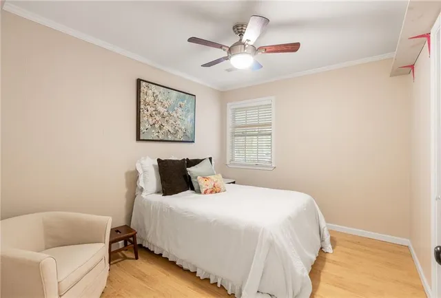 a bedroom with a bed and a couch