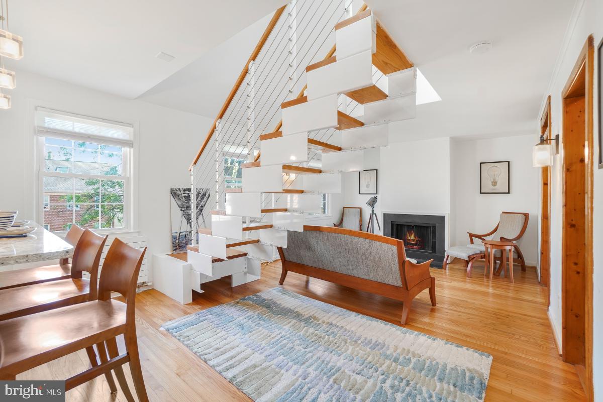 8335 Grubb Road, Unit 203 Silver Spring, MD 20910 - Photo 1 of 29 a living room with furniture and a fireplace