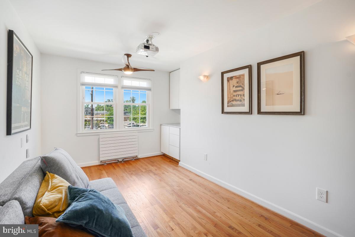 8335 Grubb Road, Unit 203 Silver Spring, MD 20910 - Photo 18 of 29 a bedroom with a bed and wooden floor