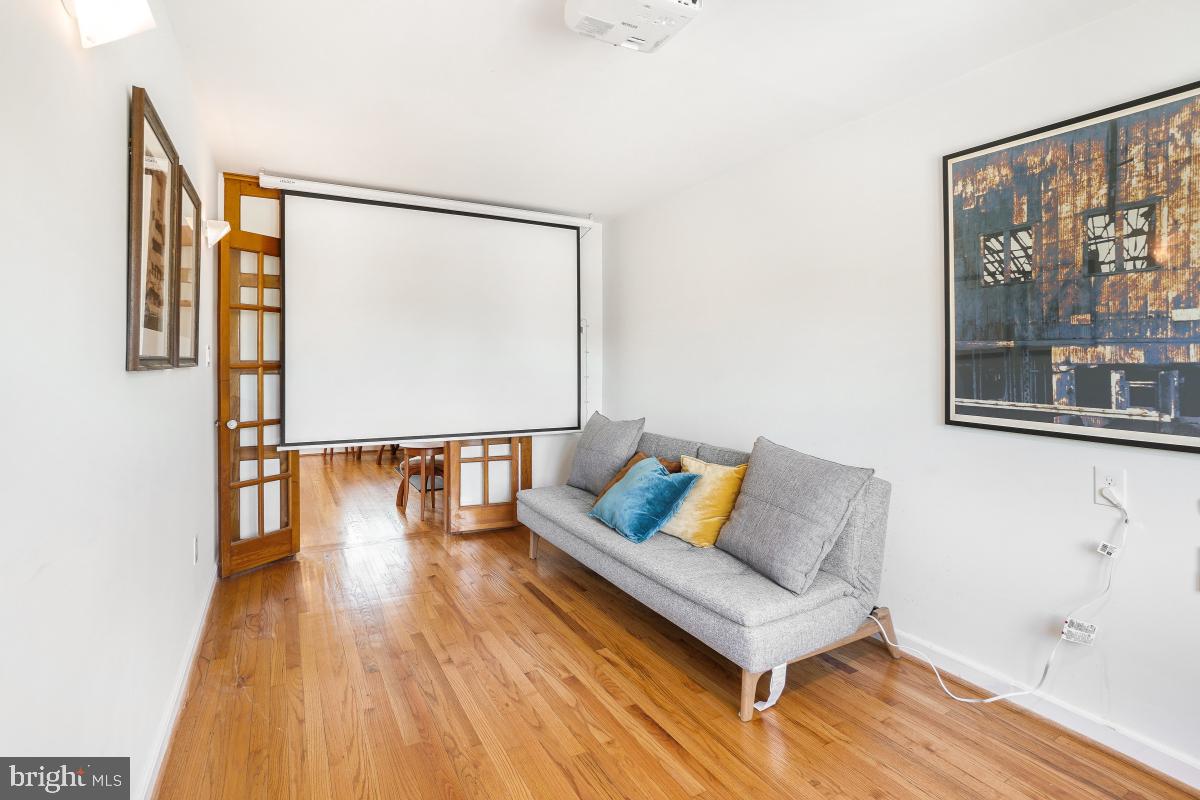 8335 Grubb Road, Unit 203 Silver Spring, MD 20910 - Photo 20 of 29 a living room with a couch and a table