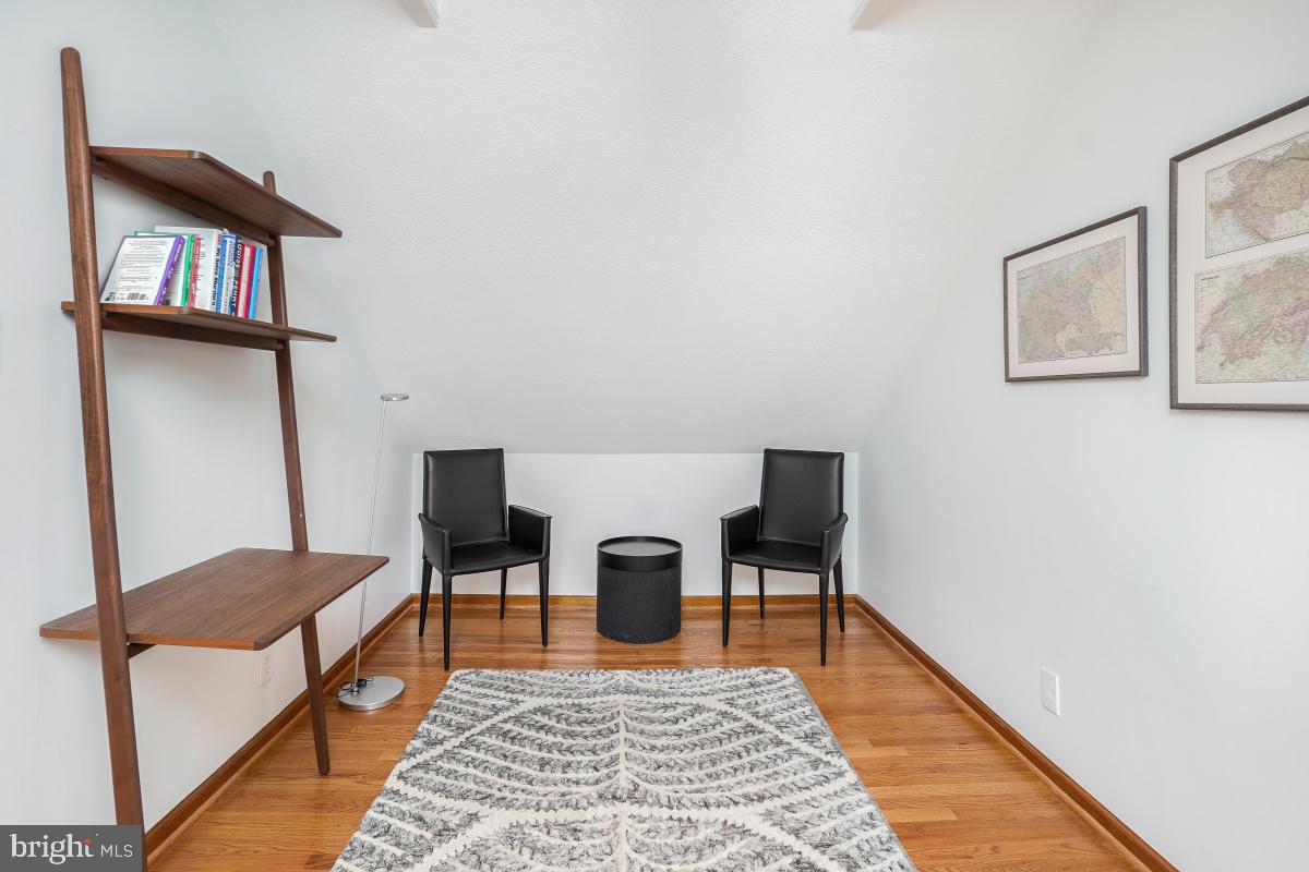 8335 Grubb Road, Unit 203 Silver Spring, MD 20910 - Photo 23 of 29 a living room with furniture and a rug