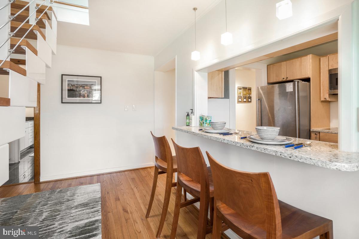 8335 Grubb Road, Unit 203 Silver Spring, MD 20910 - Photo 10 of 29 a dining room with furniture and window