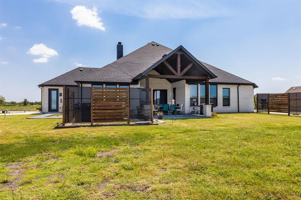 1533 Lynx Loop Forney, TX 75126 - Photo 2 of 27 a front view of a house with swimming pool having outdoor seating