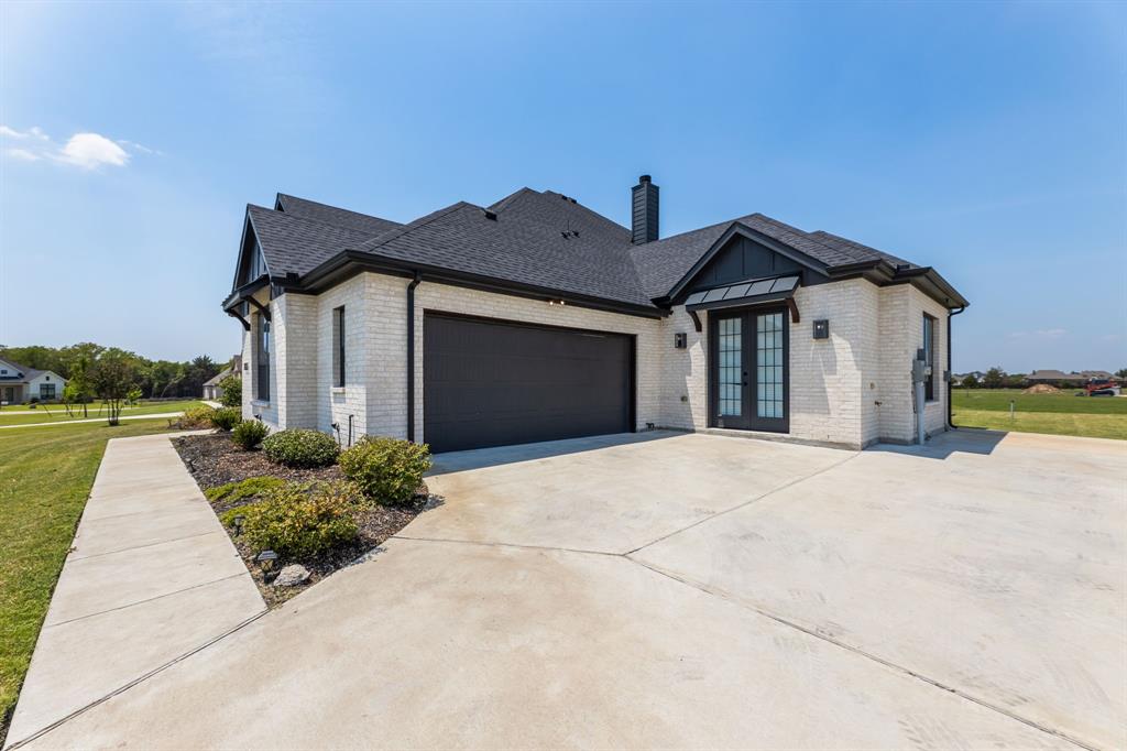 1533 Lynx Loop Forney, TX 75126 - Photo 3 of 27 a view of a house with a yard and potted plants