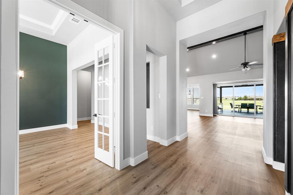 1533 Lynx Loop Forney, TX 75126 - Photo 5 of 27 a view of a hallway view with wooden floor and living room