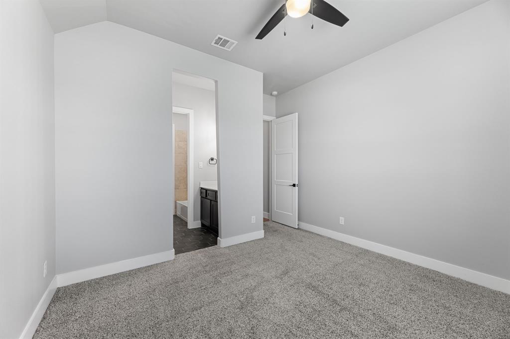 1533 Lynx Loop Forney, TX 75126 - Photo 10 of 27 an empty room with chandelier fan