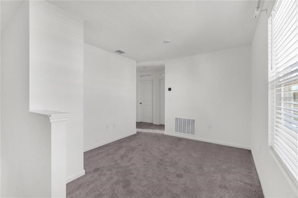 1623 Indiana Loop Sumterville, FL 33585 - Photo 4 of 6 a view of an empty room with a window