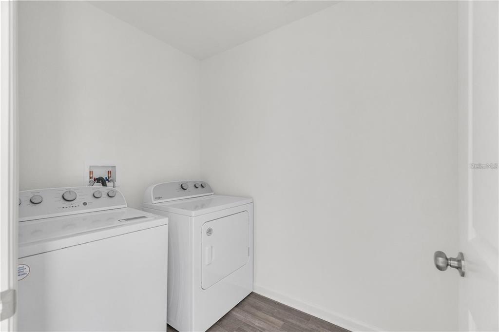 1623 Indiana Loop Sumterville, FL 33585 - Photo 5 of 6 a utility room with dryer and washer