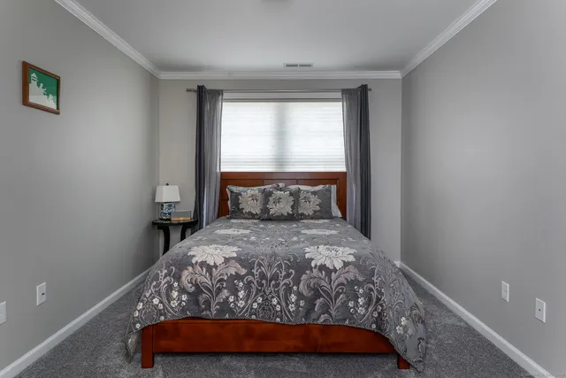a bathroom with a toilet a sink and a mirror