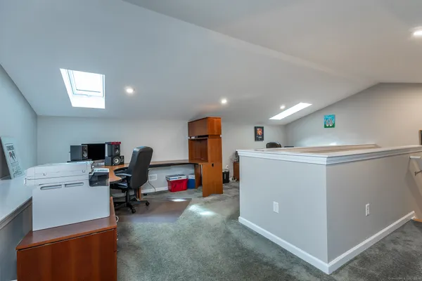 a view of a workspace with furniture