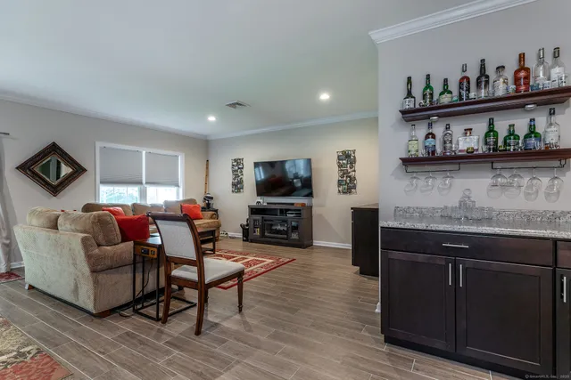 a living room with furniture and a rug