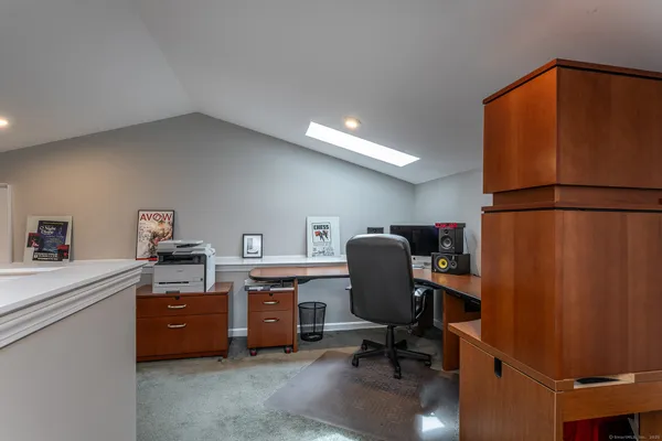 a kitchen with stainless steel appliances granite countertop a refrigerator and a wooden cabinets