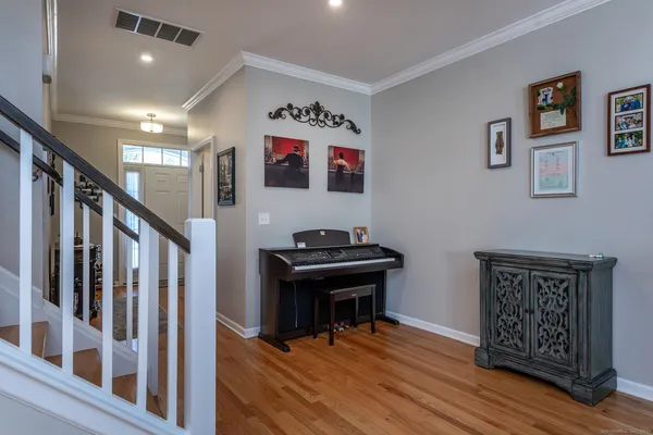a view of an entryway with wooden floor