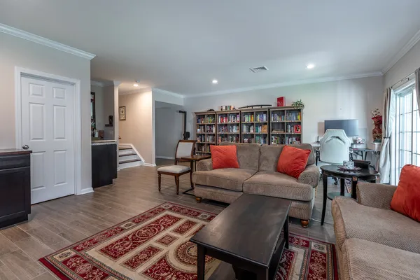 a living room with furniture and a rug