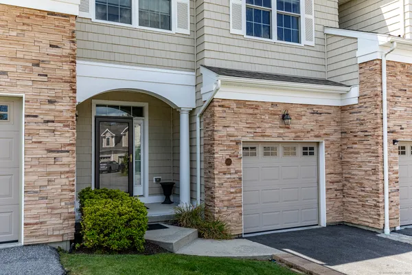 front view of a house with a small yard