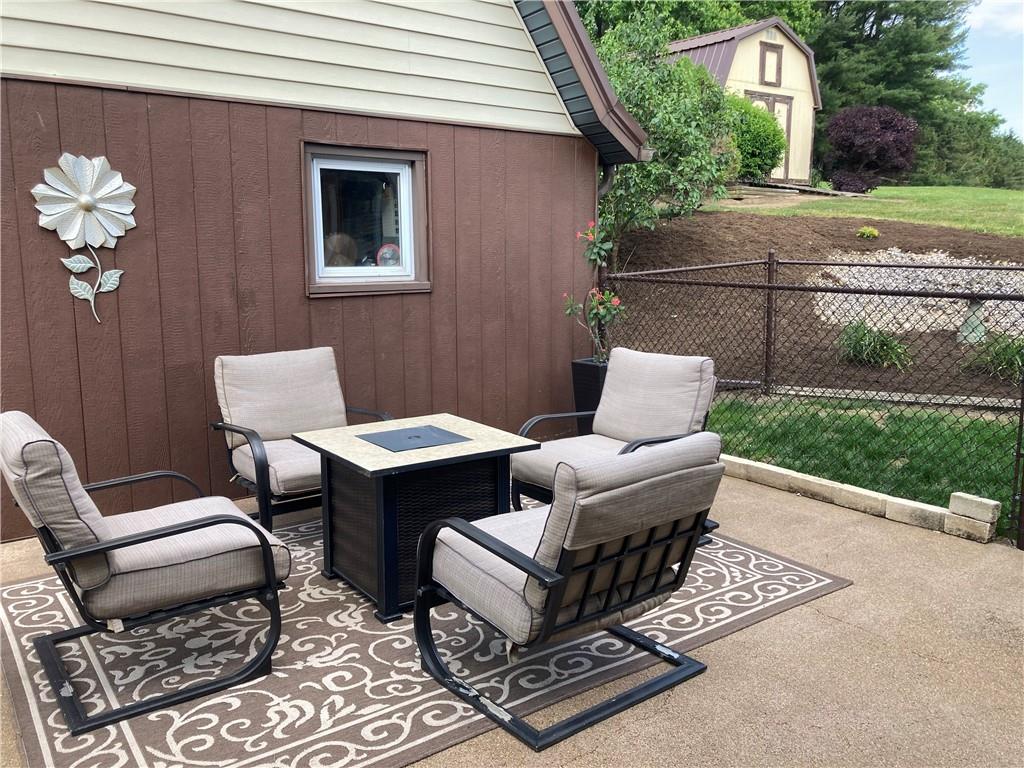 26 Paxton Road Sandy Lake, PA 16145 - Photo 3 of 23 a outdoor living space with furniture and a garden