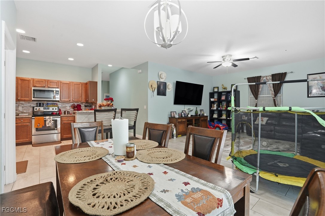 1004 Hamilton Street Immokalee, FL 34142 - Photo 13 of 45 a view of a dining room with furniture