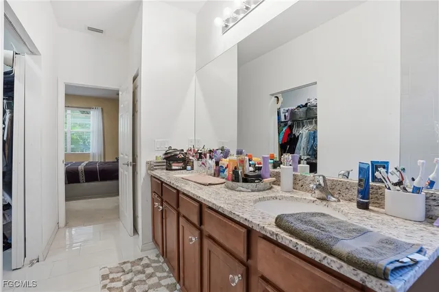 a bathroom with sink and mirror
