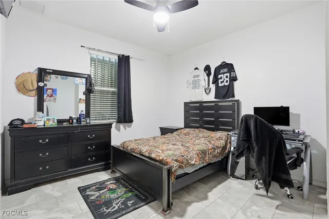 a bedroom with a bed and furniture