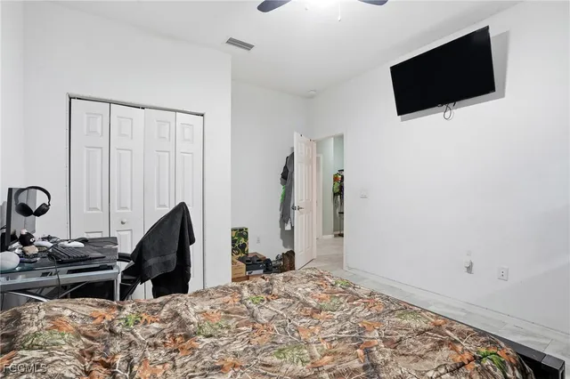 a view of a livingroom with furniture and flat screen tv